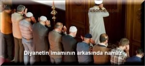 Diyanetin imaminin arkasinda nama